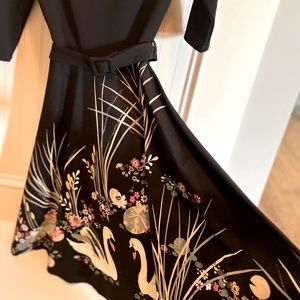 Adult small Black A-line dress with swan design on bottom half.